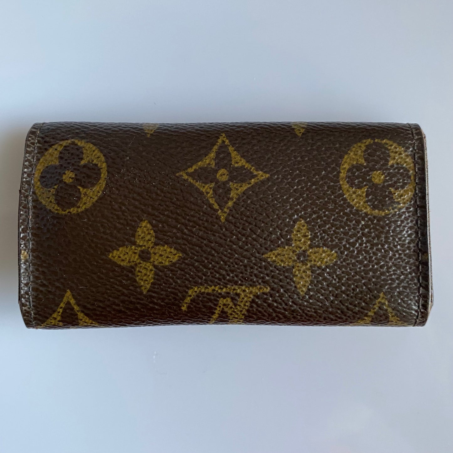 Louis Vuitton monogram 4 ring key holder Authentic with coa