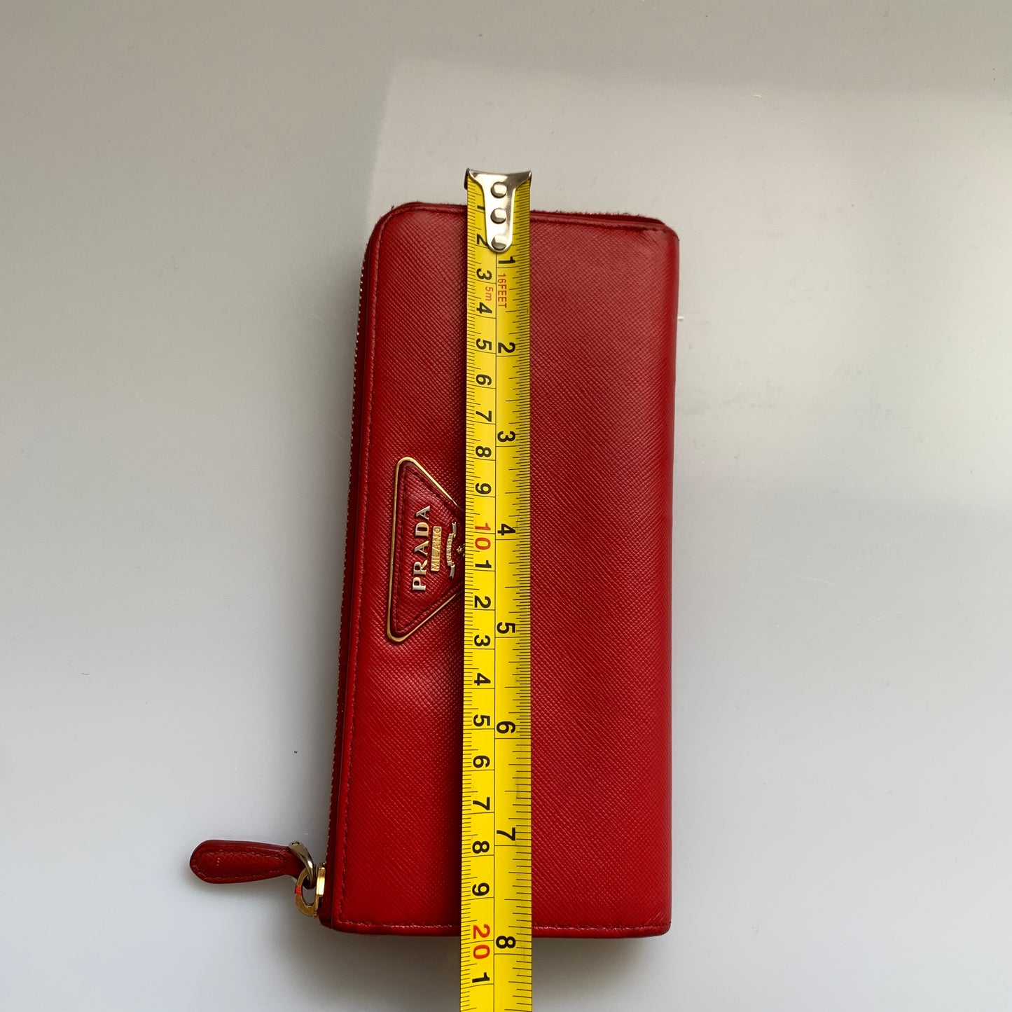 Prada women’s red long zip around wallet Authentic of COA