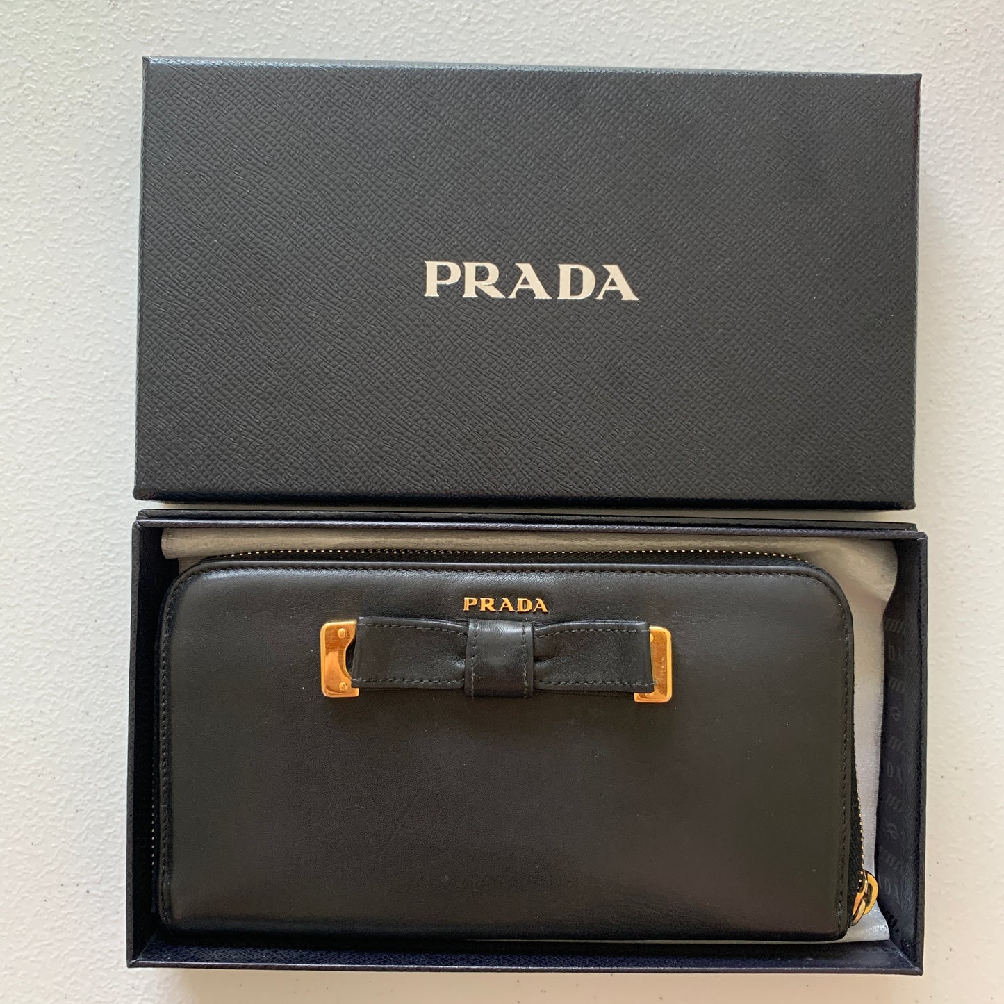 Prada bow long black leather zip around wallet authentic with COA and box