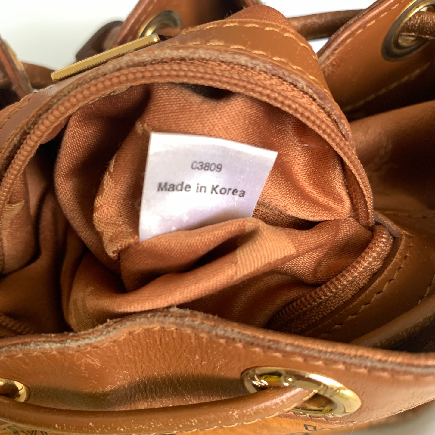 MCM cognac bucket crossbody bag Authentic with COA