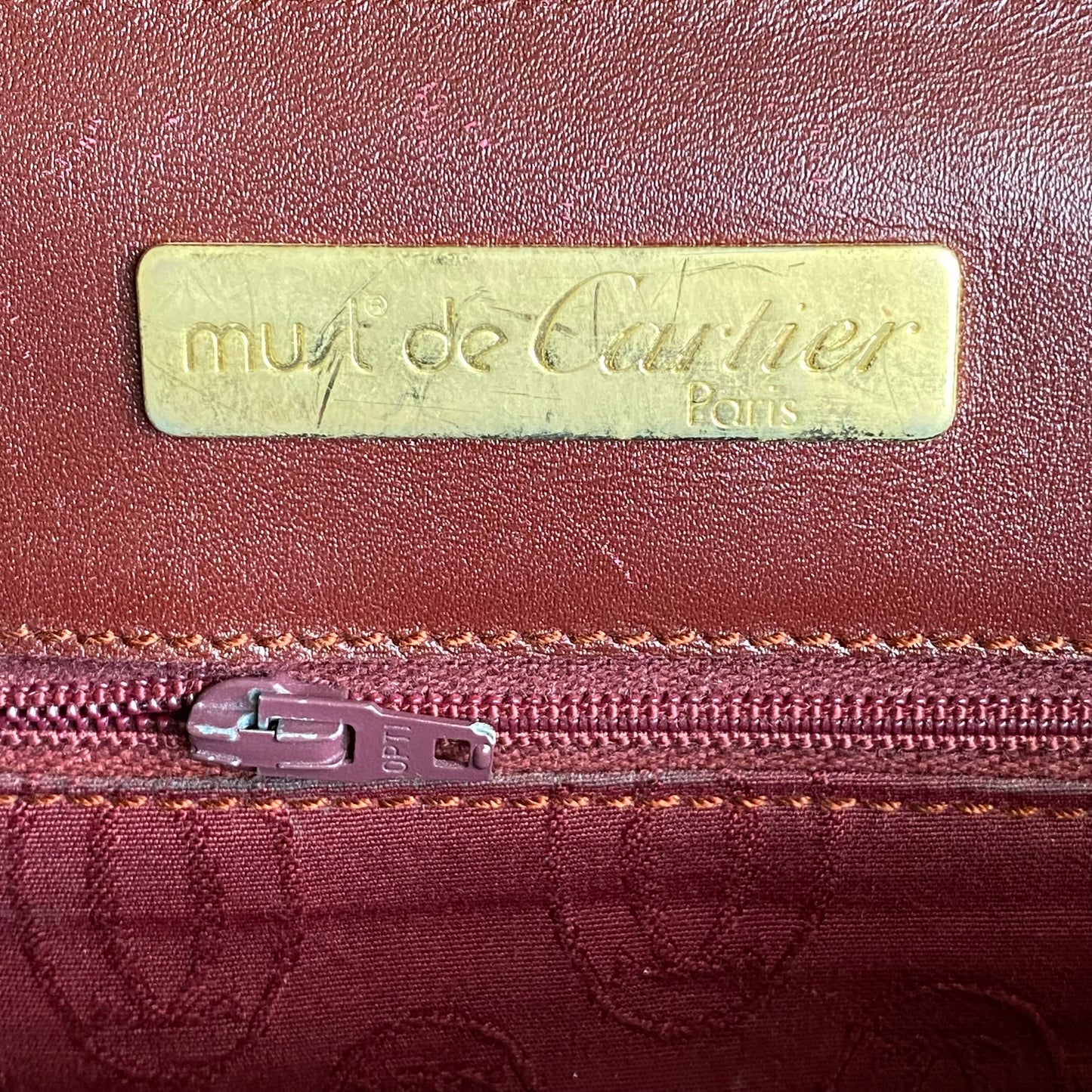 Cartier  burgundy leather Clutch bag Authentic with COA