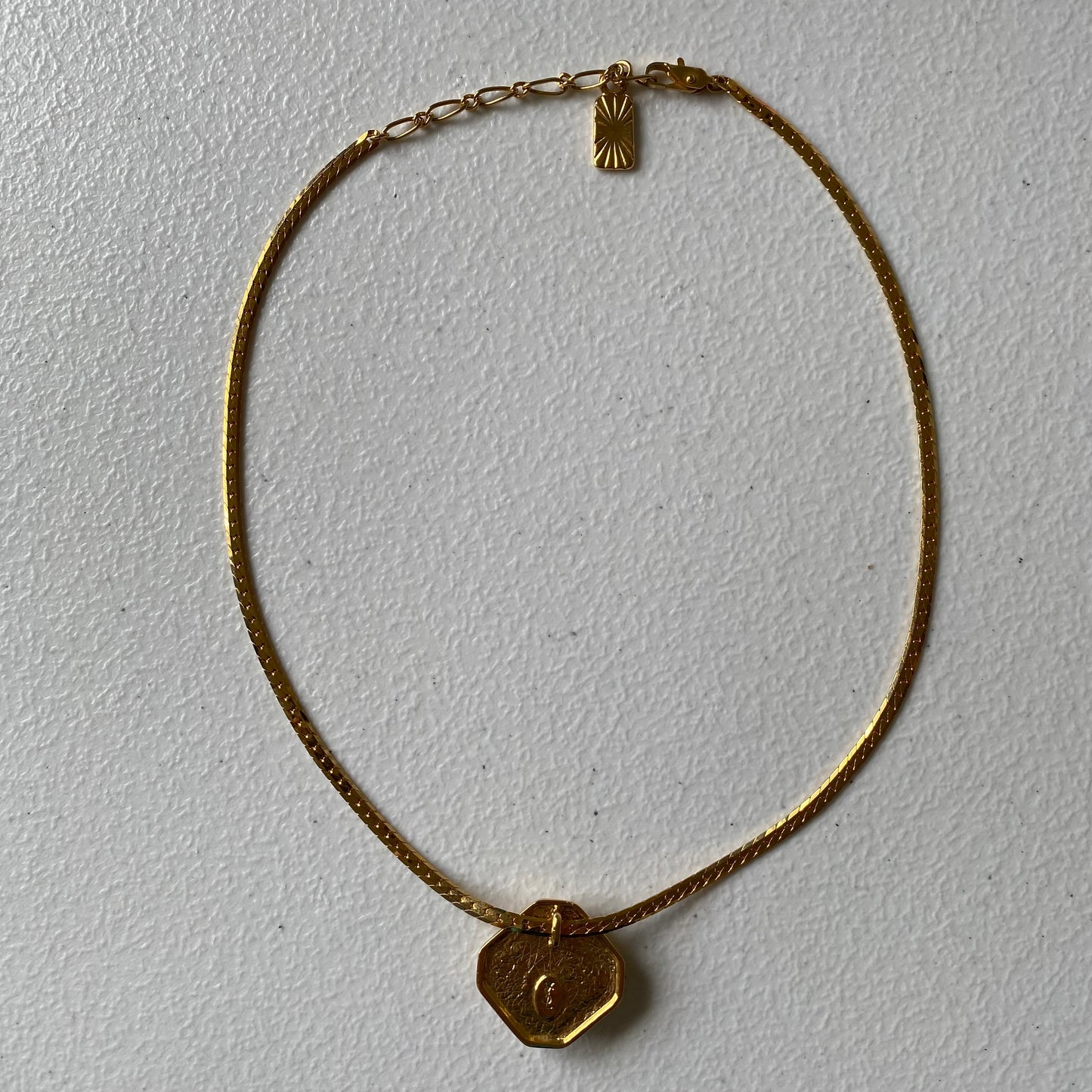 Yves Saint Laurent YSL logo 1 inch pendant gold plated adjustable necklace Authentic with COA