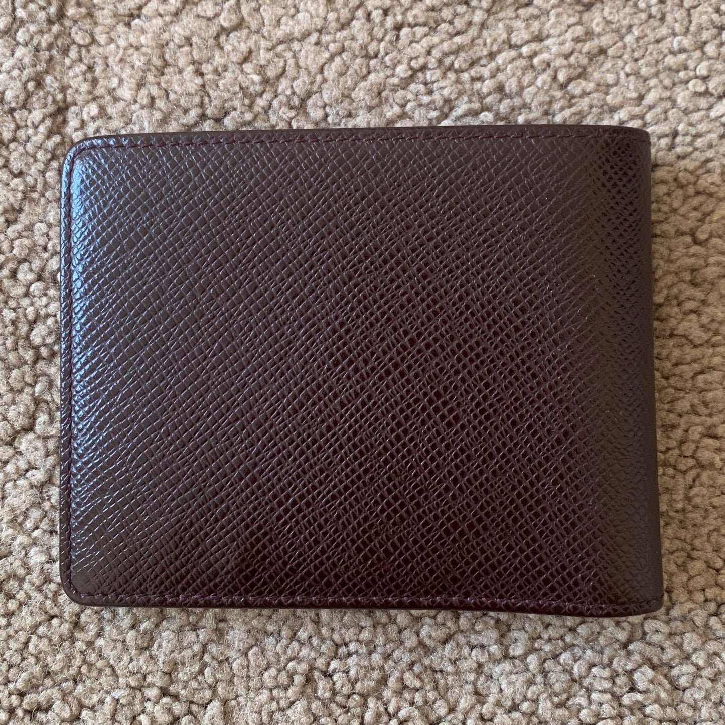 LV1017 Louis Vuitton men's bifold taiga brown leather wallet