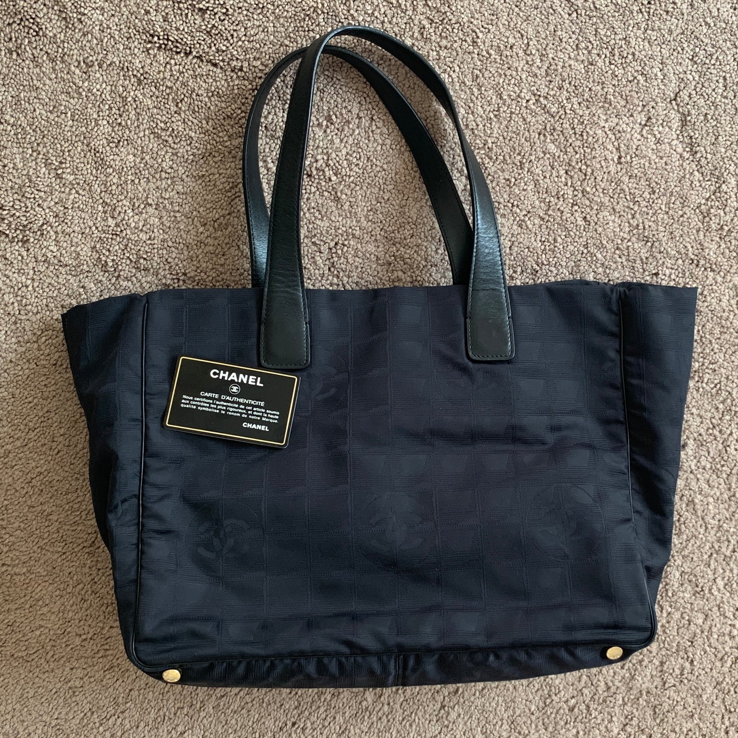 Authentic Chanel women’s New Travel Line black logo tote bag