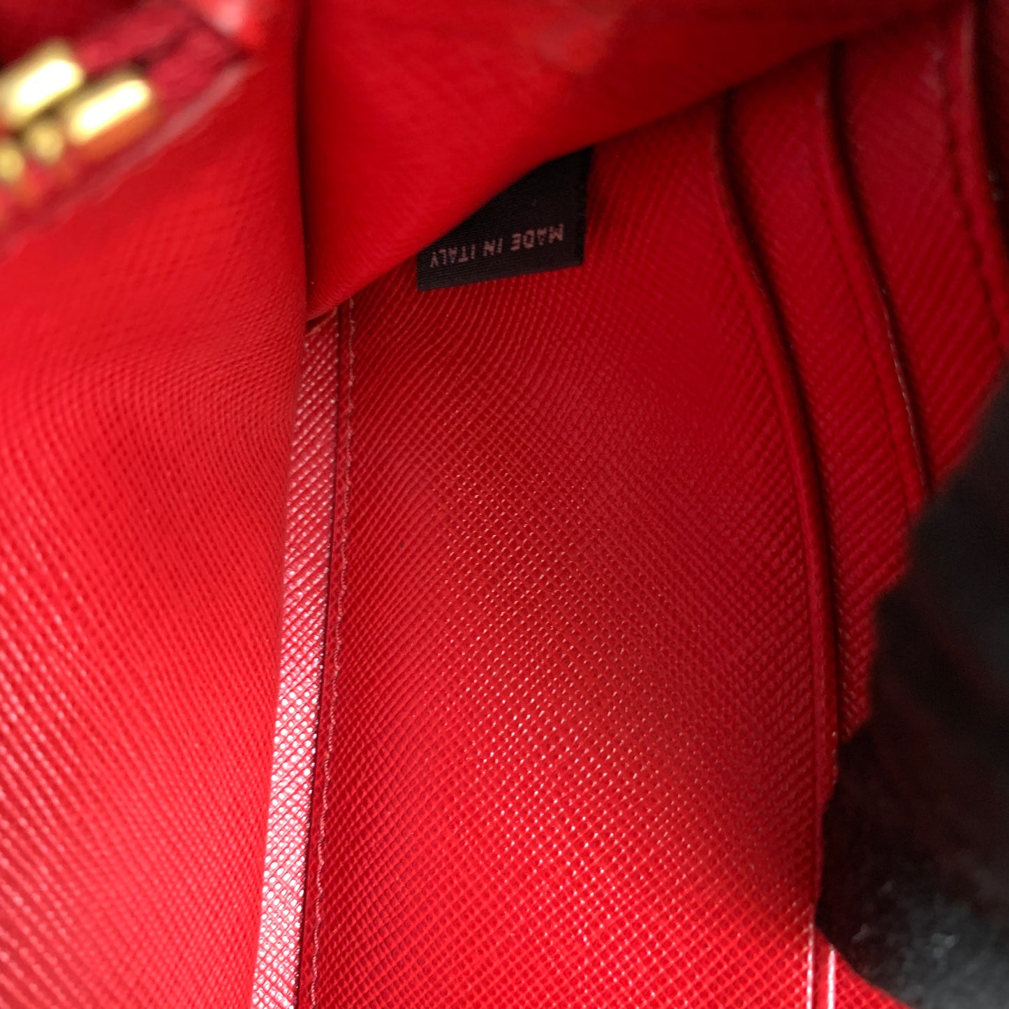 Prada women’s red long zip around wallet Authentic of COA