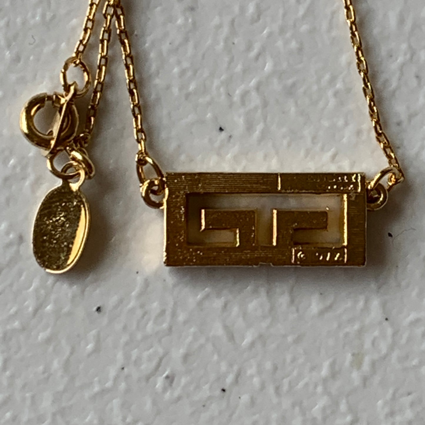 Givenchy gold plated logo pendant necklace Authentic with COA
