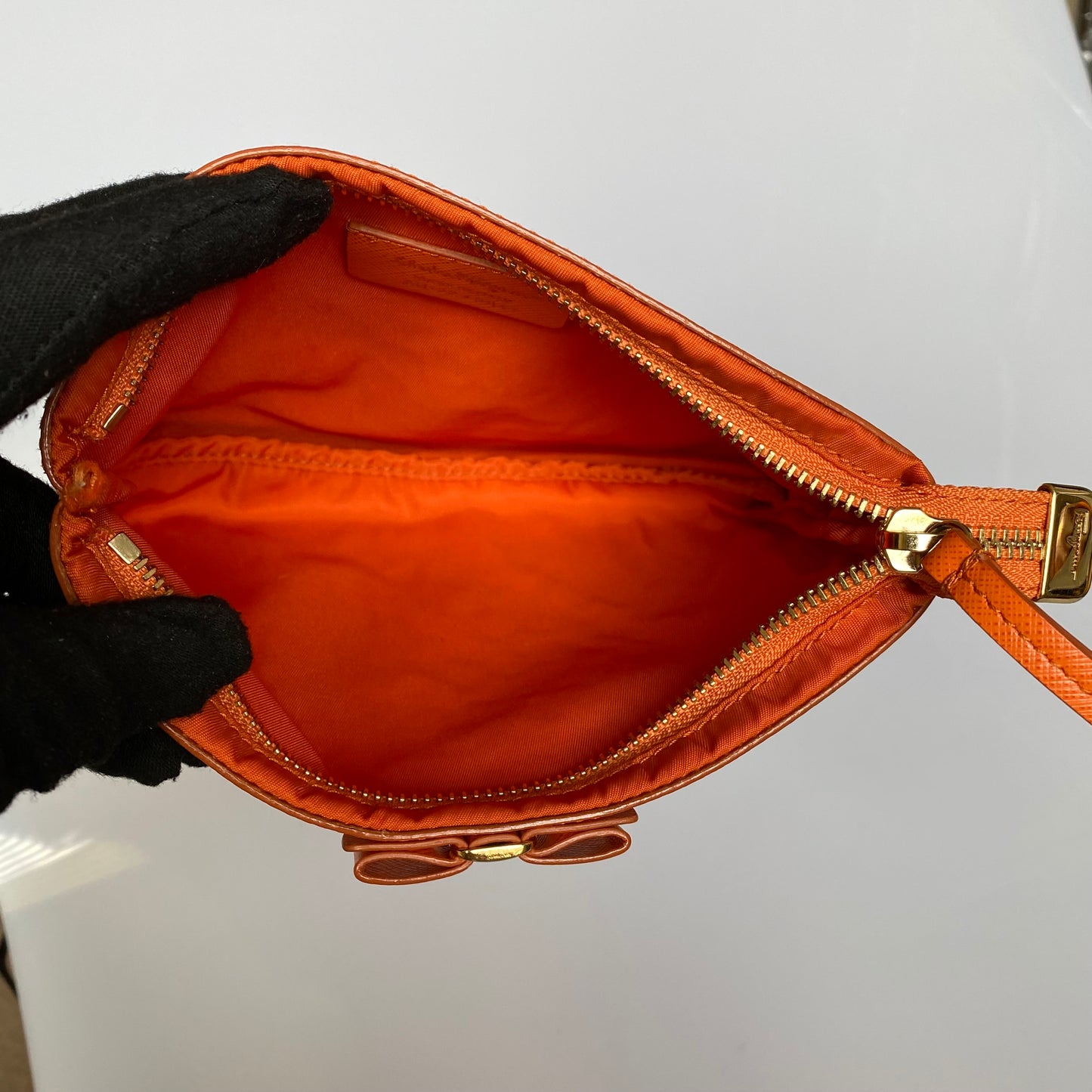 Ferragamo Orange vara bow pouch Authentic with COA