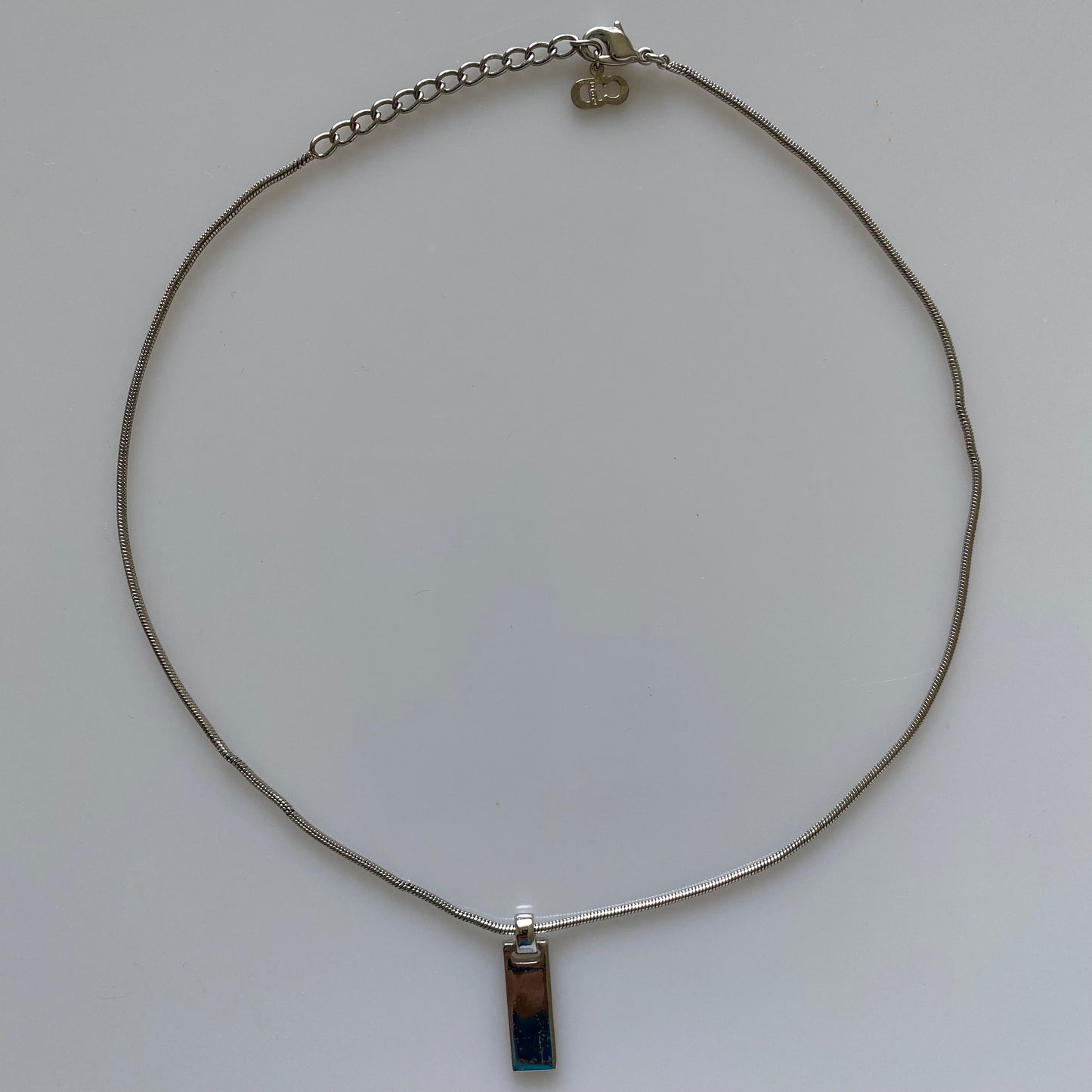 Dior silver tone logo plate pendant necklace Authentic with COA