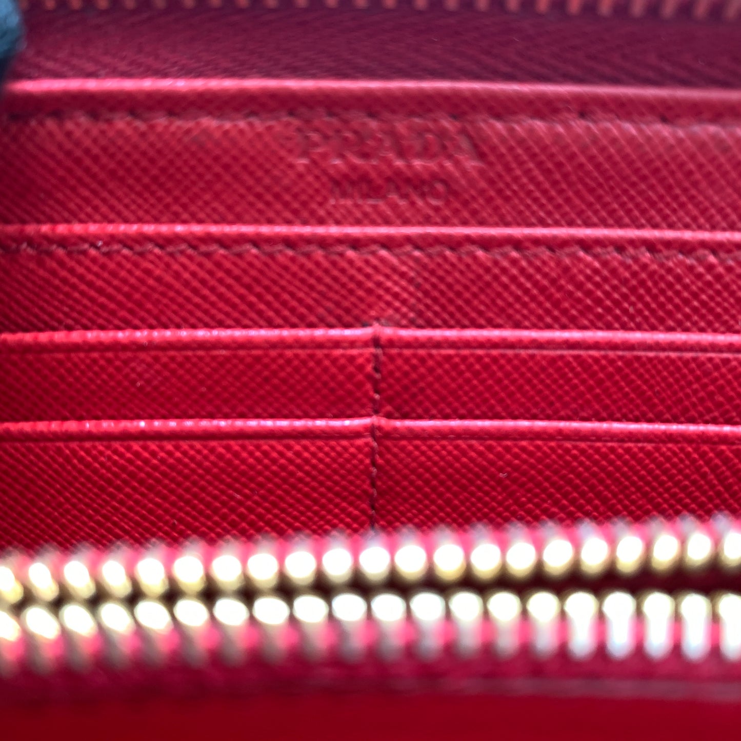Prada women’s red long zip around wallet Authentic of COA