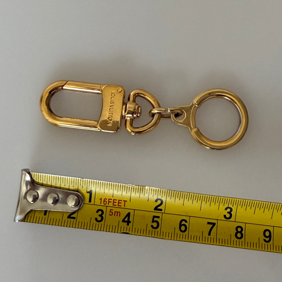 Louis Vuitton gold tone key ring  holder Authentic with COA 3 inch